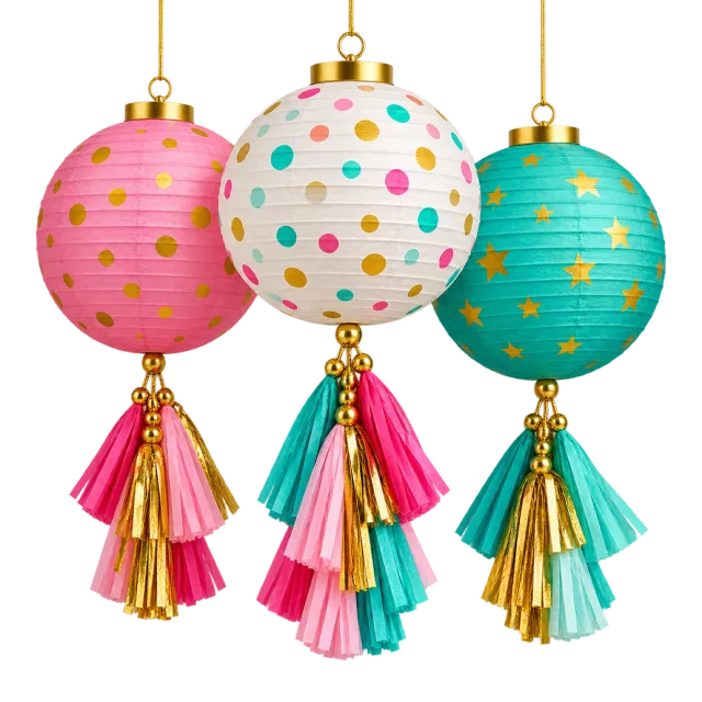Three hanging paper lanterns in pink, white and teal with dots, gold accents and colorful tassels