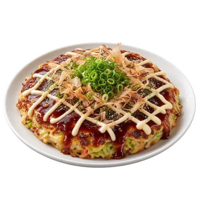 A round savory pancake topped with dark sauce, a pale sauce lattice, thin flakes and chopped scallions