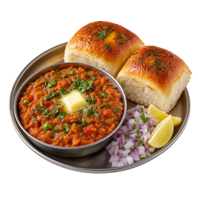 A metal tray holding thick vegetable curry with a pat of butter, browned bread rolls, chopped onion and lemon