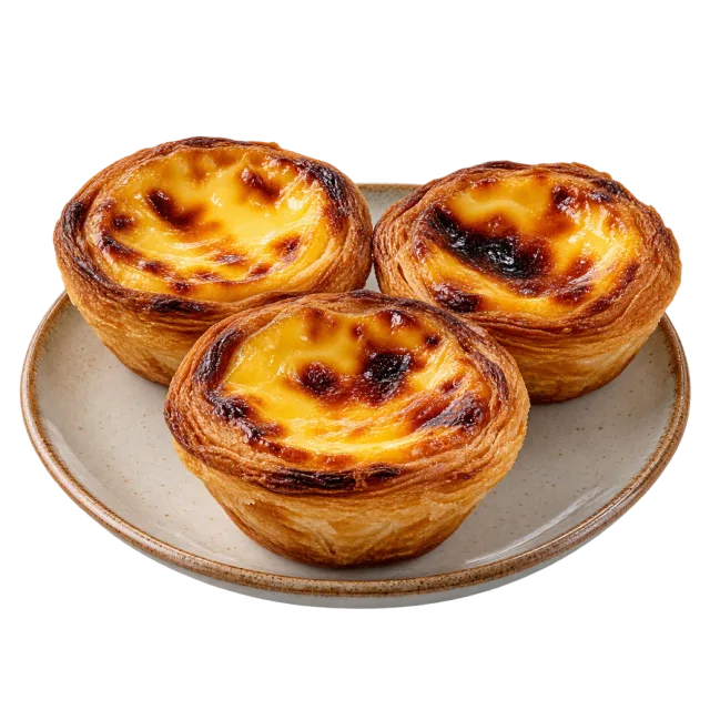 Three golden flaky pastry tarts with browned custard tops on a light-colored plate