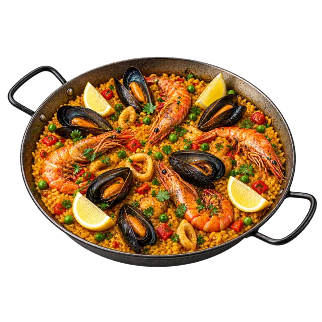 A handled black pan of golden rice topped with shrimp, mussels, green garnish and lemon wedges