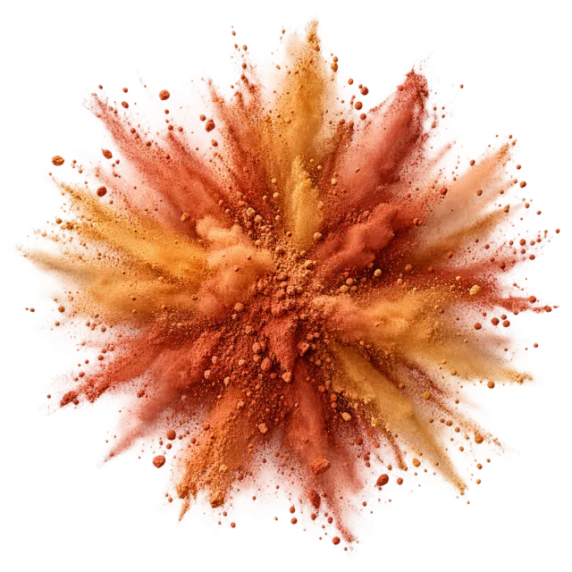 Rust-orange powder erupts outward in a textured cloud