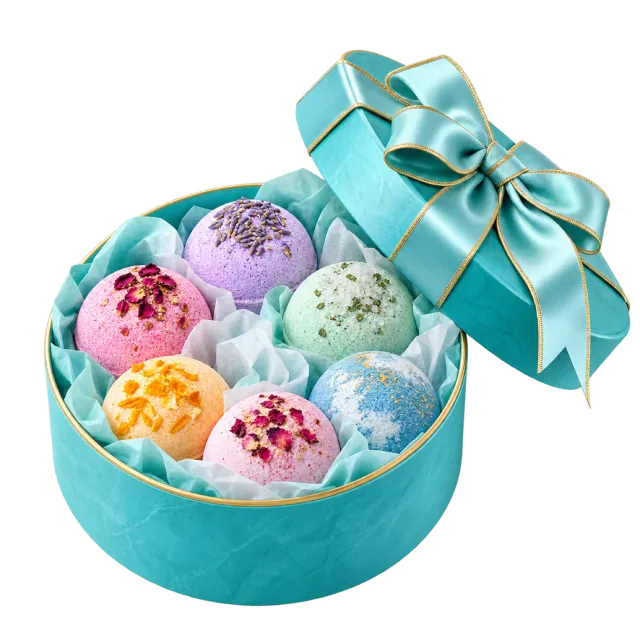 A round turquoise box holds colorful bath-bomb spheres beneath a matching ribboned lid
