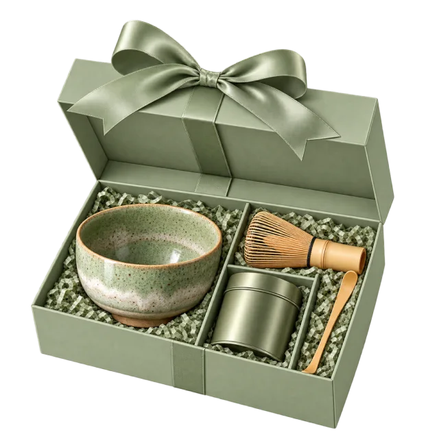 An open green box holds a tea bowl, bamboo whisk, scoop and small canister