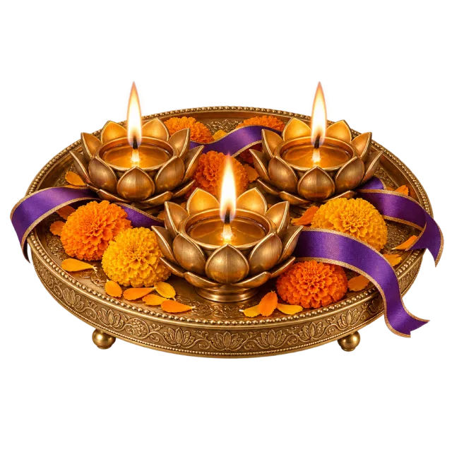 A gold-colored tray holds lotus-shaped lamps, marigolds and purple ribbon