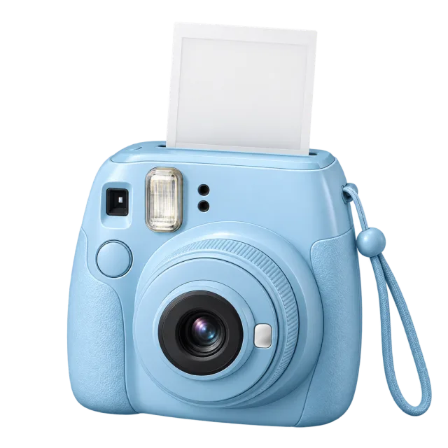 A pale blue instant camera has a white print emerging from the top