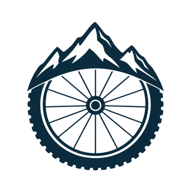 A bicycle wheel sits beneath mountain peaks