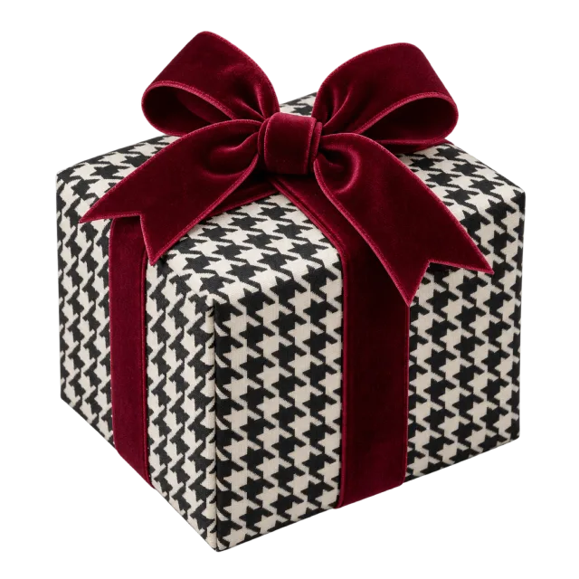 A black-and-white houndstooth parcel tied with a deep burgundy bow