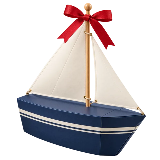 A blue-and-white sailboat-shaped box with a cream sail and a red bow