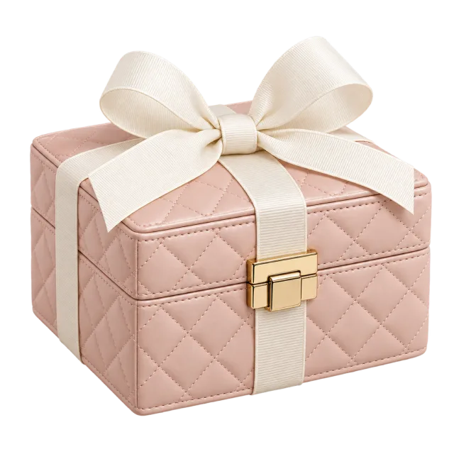 A pale pink quilted-style box with a gold clasp and a cream bow