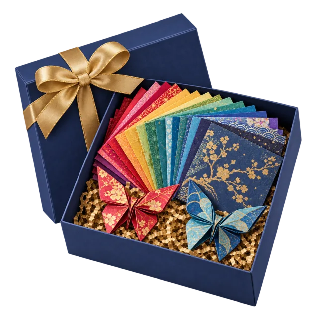 A navy gift box with colorful patterned paper sheets and folded paper shapes beneath a gold bow