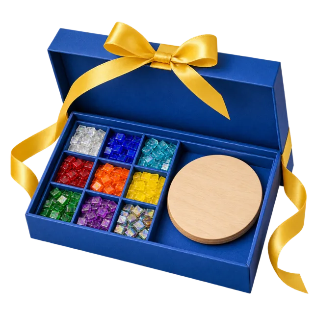 A blue craft box with compartments of colored mosaic pieces and a round wooden blank