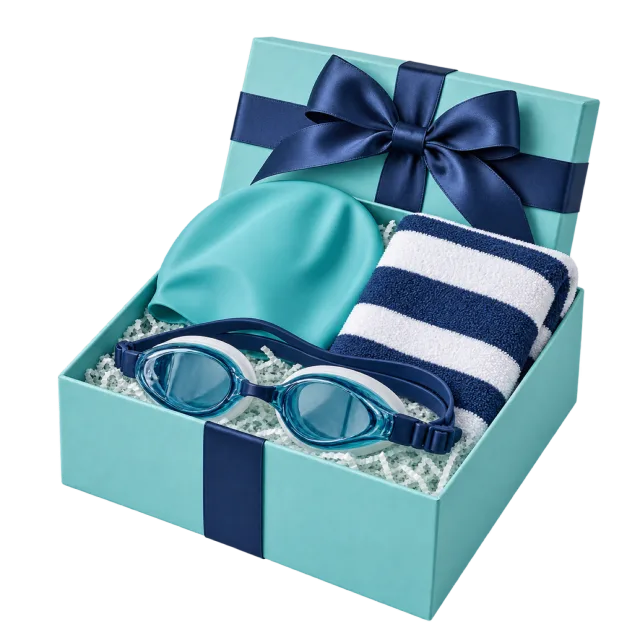 A turquoise gift box with swimming goggles, a matching cap and a blue-and-white striped towel