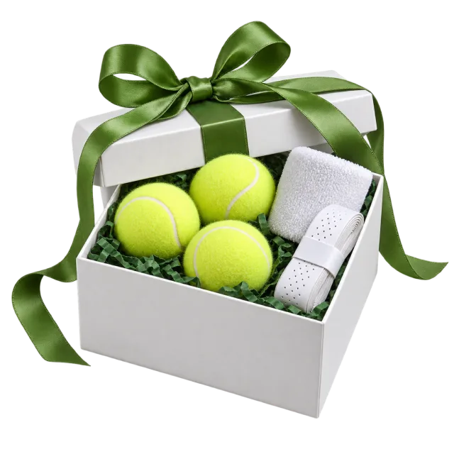 A white gift box containing three yellow tennis balls and a folded white towel with a green bow