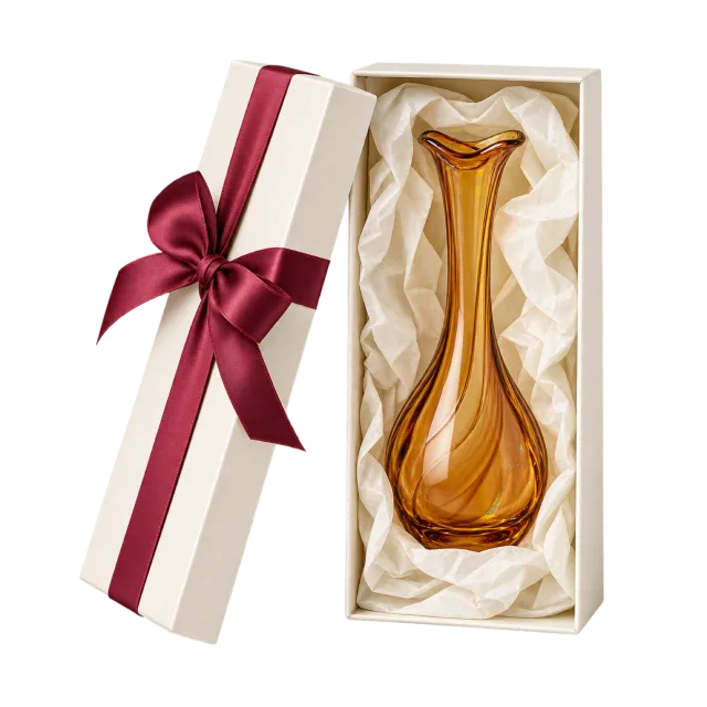 A tall cream presentation box with an amber-colored glass vase and a burgundy ribbon