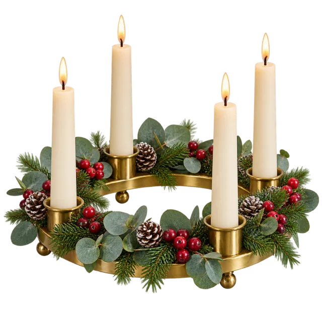 Four lit ivory candles in a gold-colored ring decorated with greenery and red berries