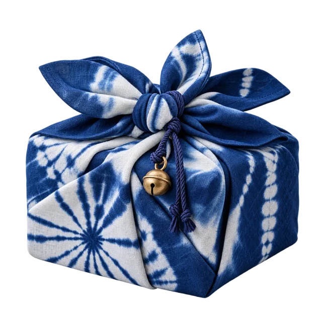 Blue and white tie-dye-style fabric parcel tied in a knot with a small bell