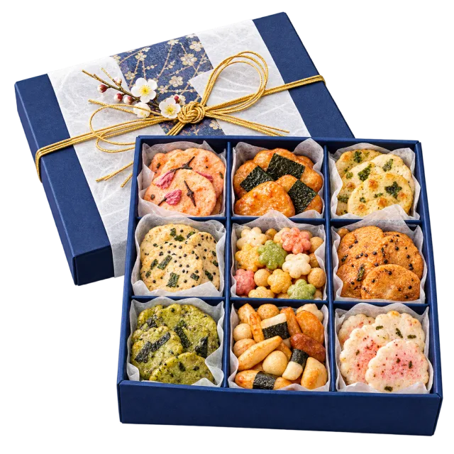Blue compartmented gift box containing assorted colorful rice crackers