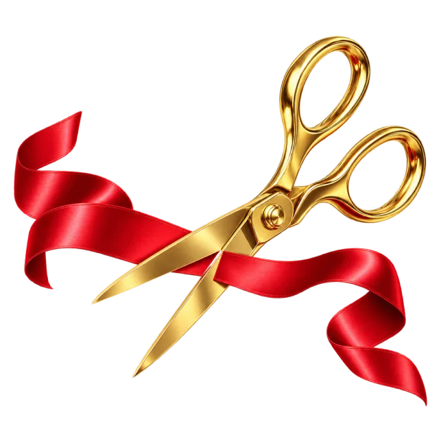 Gold-colored scissors cutting through a flowing red ribbon