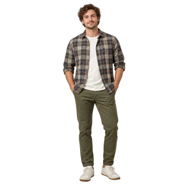 Man wearing a checked overshirt, white T-shirt and olive trousers