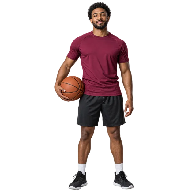 Man in a burgundy T-shirt and black sports shorts holding a basketball