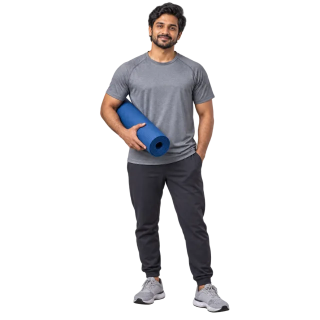Man in a grey T-shirt and dark trousers holding a rolled blue exercise mat