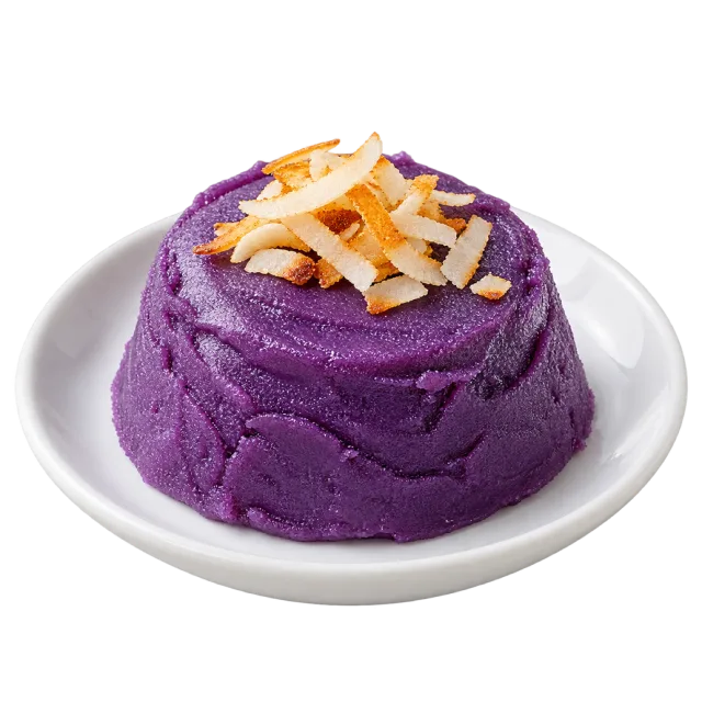 Purple ube halaya mound topped with toasted coconut strips on a white plate