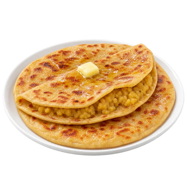 Stacked golden puran poli with browned spots and a small pat of butter