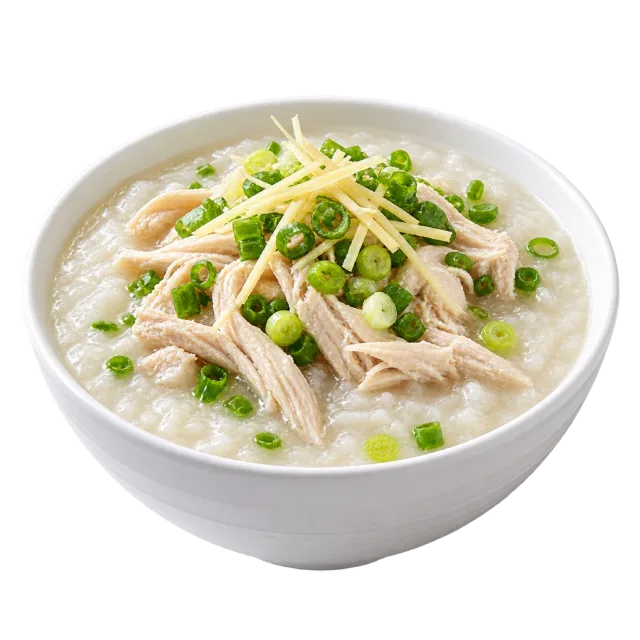 Chicken congee topped with shredded chicken, green onion and thin pale strips