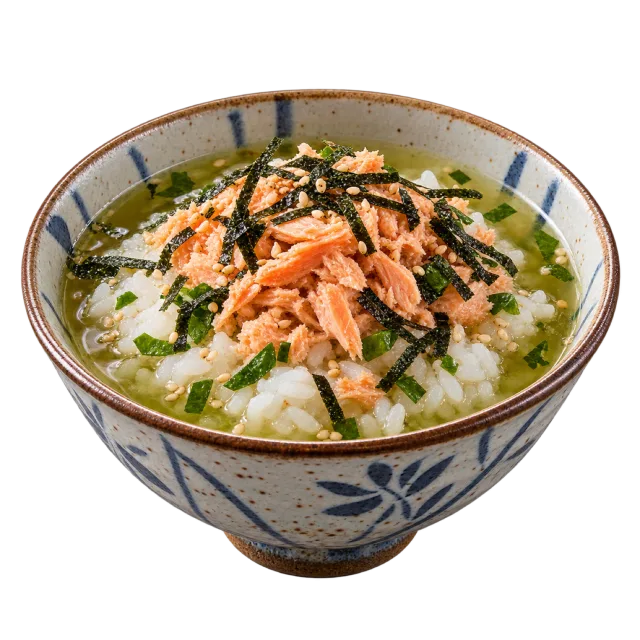Ochazuke in a patterned bowl with rice, salmon-colored flakes, green garnish and dark seaweed strips