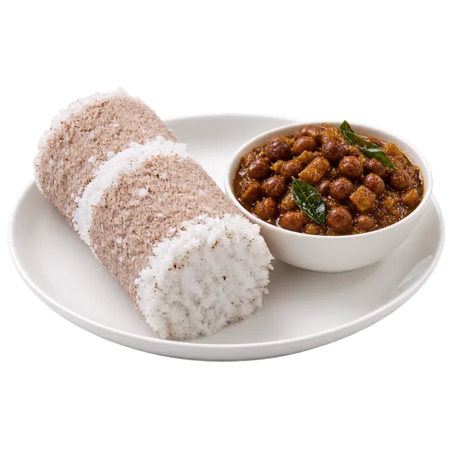 Cylindrical puttu pieces with white coconut layers beside a bowl of kadala curry