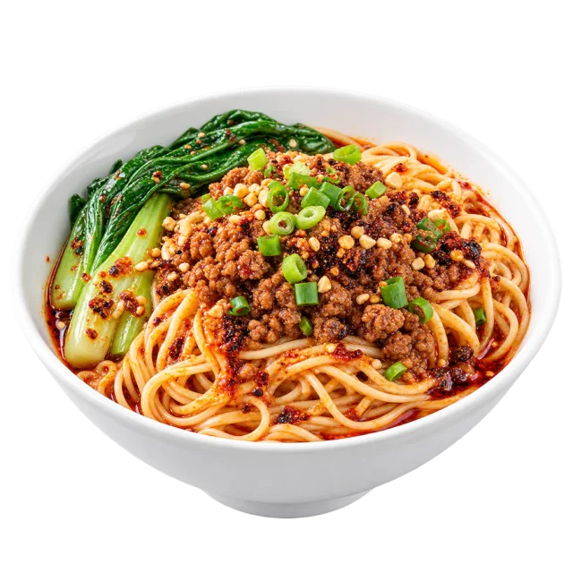 Dan dan noodles topped with browned crumbles, peanuts, green onion and leafy greens