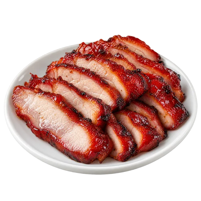 Sliced char siu pork with glossy reddish edges and pale centers