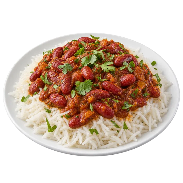 Rajma served over white rice with chopped green herbs on top
