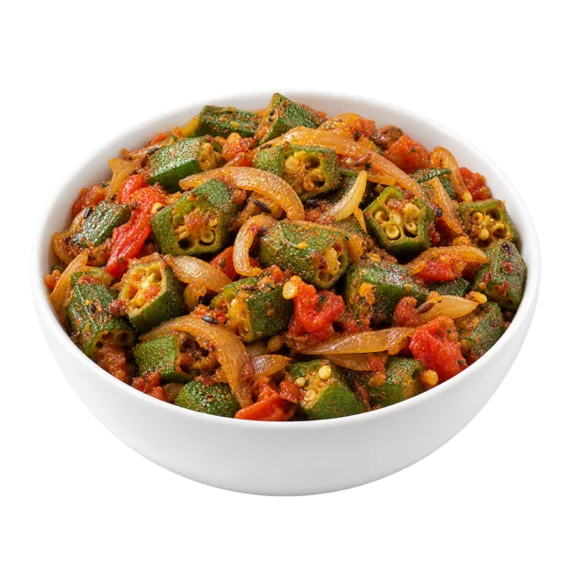 Bhindi masala with sliced okra, tomato and onion in a white bowl