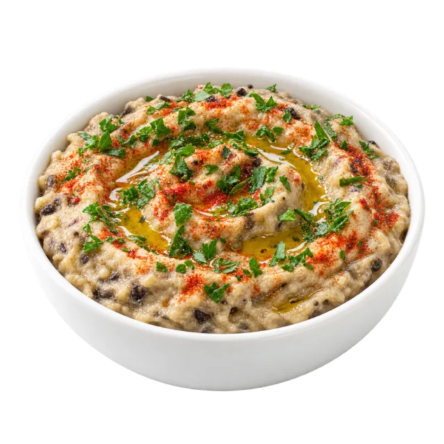 Pale textured baba ganoush topped with herbs, red seasoning and a drizzle of oil
