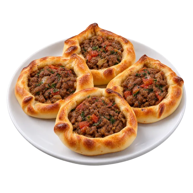 Three small open sfiha pies filled with browned minced meat and red vegetable pieces