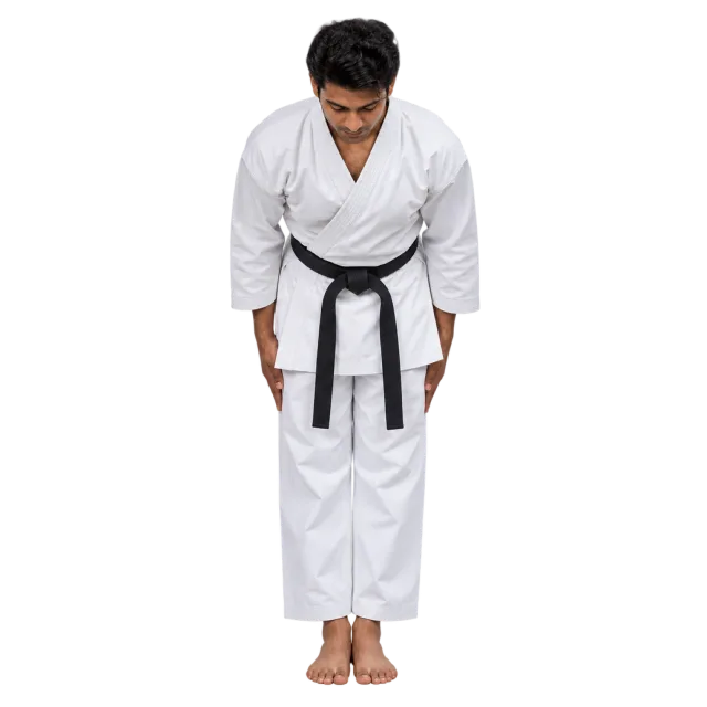Practitioner in a white uniform and black belt bowing with hands beside the thighs