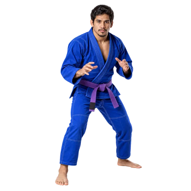 Jiu-jitsu practitioner in a blue gi and purple belt with hands raised