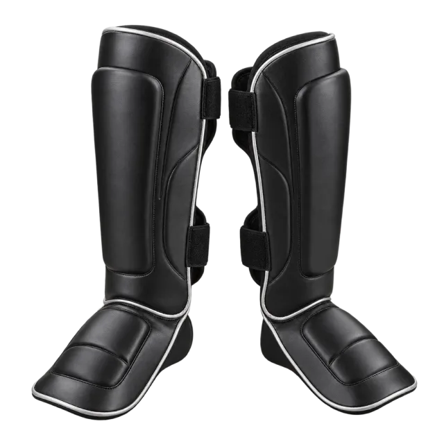 Pair of black shin guards with attached foot padding