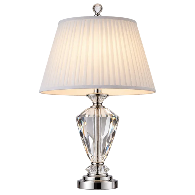 Clear faceted table lamp with a metallic base and pleated cream shade