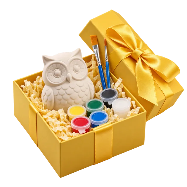Yellow painting gift kit with an unpainted owl figure, paint pots and brushes
