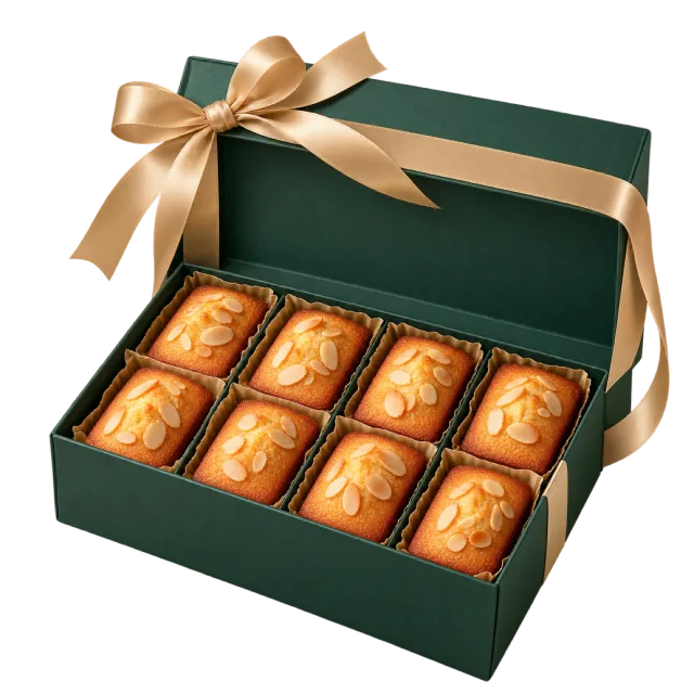 Dark green gift box holding rows of small golden rectangular cakes