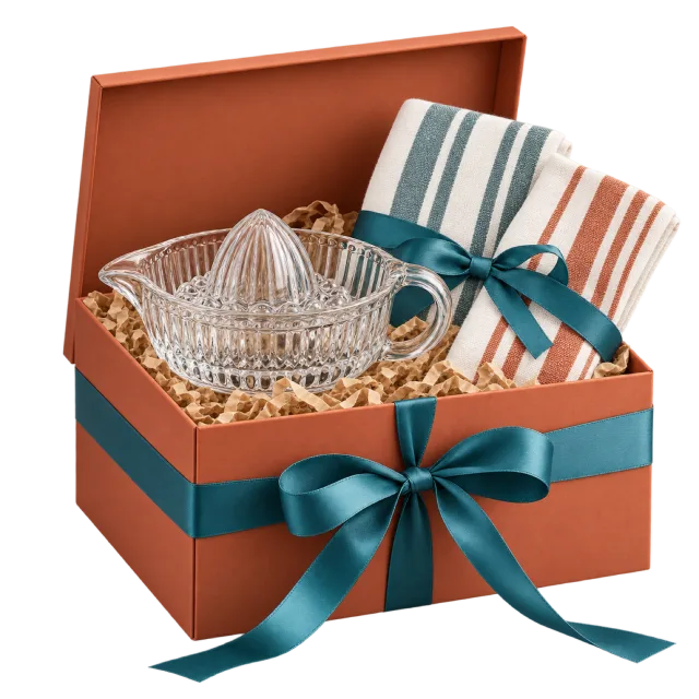 Terracotta gift box with a clear citrus juicer, striped towels and a teal bow