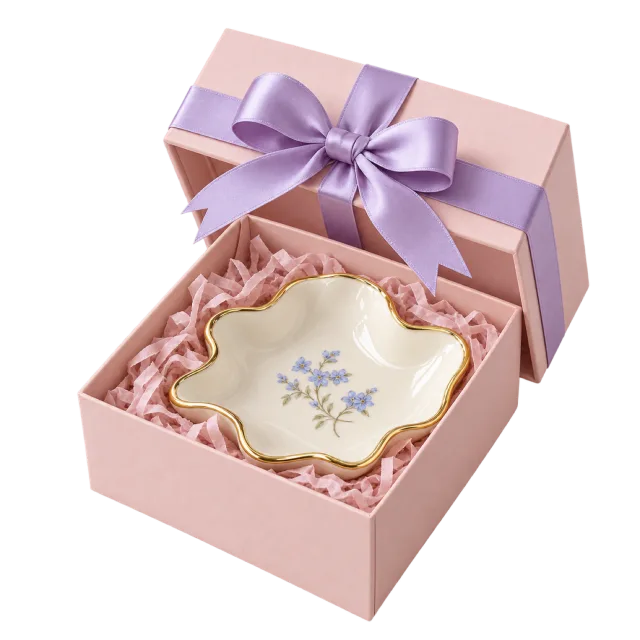 Pink gift box with a flower-shaped trinket dish and lilac ribbon