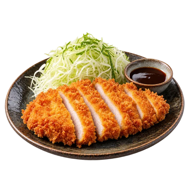 Sliced breaded cutlet with shredded cabbage and a bowl of dark dipping sauce