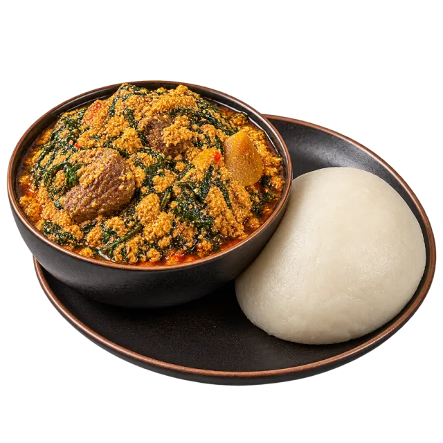Bowl of thick orange and green stew with meat pieces beside a smooth white mound