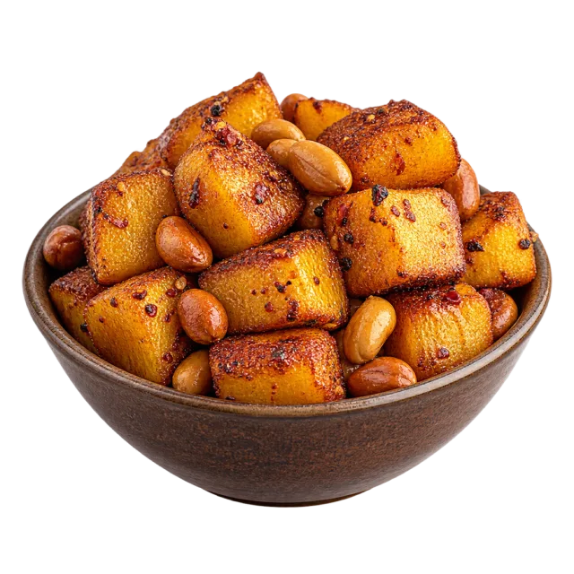 Bowl of golden fried plantain cubes with visible seasoning and scattered peanuts