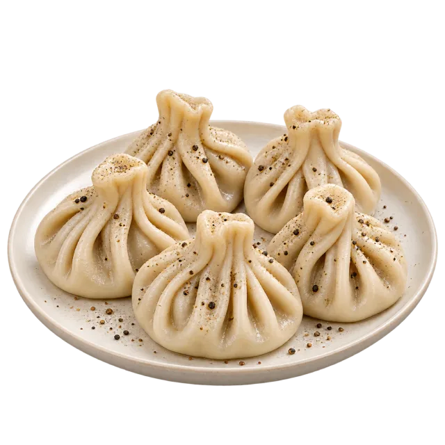 Pleated pouch-shaped dumplings with twisted tops on a white plate