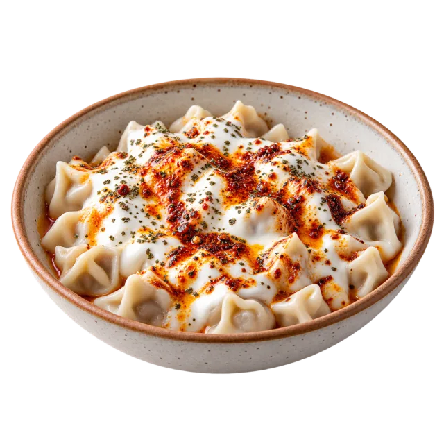Small folded dumplings topped with white yogurt-style sauce, red oil and herbs